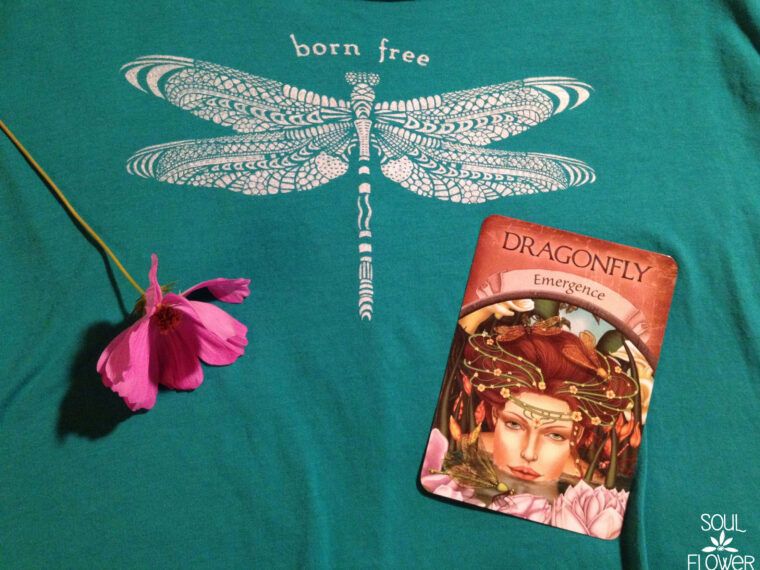 A teal shirt with a detailed dragonfly and "born free" text, a pink flower, and a dragonfly-themed oracle card labeled Emergence—perfect for anyone drawn to the magic of Dragonfly Medicine. Soul Flower Blog: Hippie Style & Kind Living