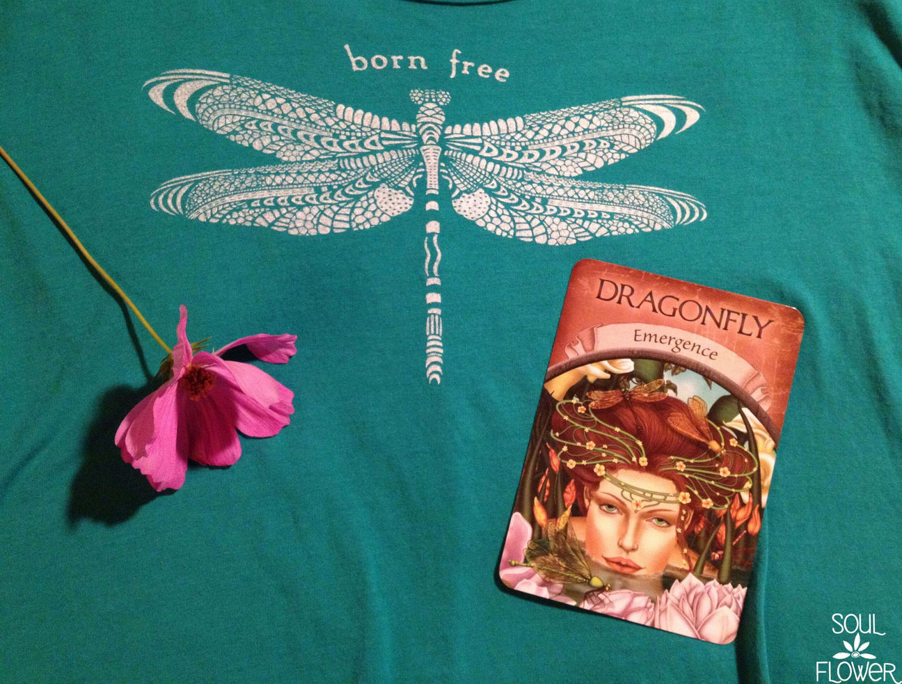 A teal shirt with a detailed dragonfly and "born free" text, a pink flower, and a dragonfly-themed oracle card labeled Emergence—perfect for anyone drawn to the magic of Dragonfly Medicine. Soul Flower Blog: Hippie Style