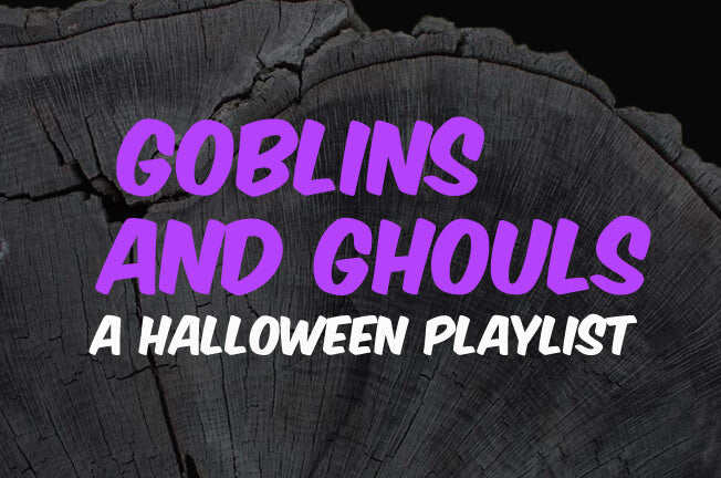 Text reading Goblins and Ghouls: A Halloween Playlist in bold purple and white letters is displayed over a close-up of a dark tree stump, setting the perfect eerie mood for your ultimate Halloween playlist. Soul Flower Blog: Hippie Style & Kind Living