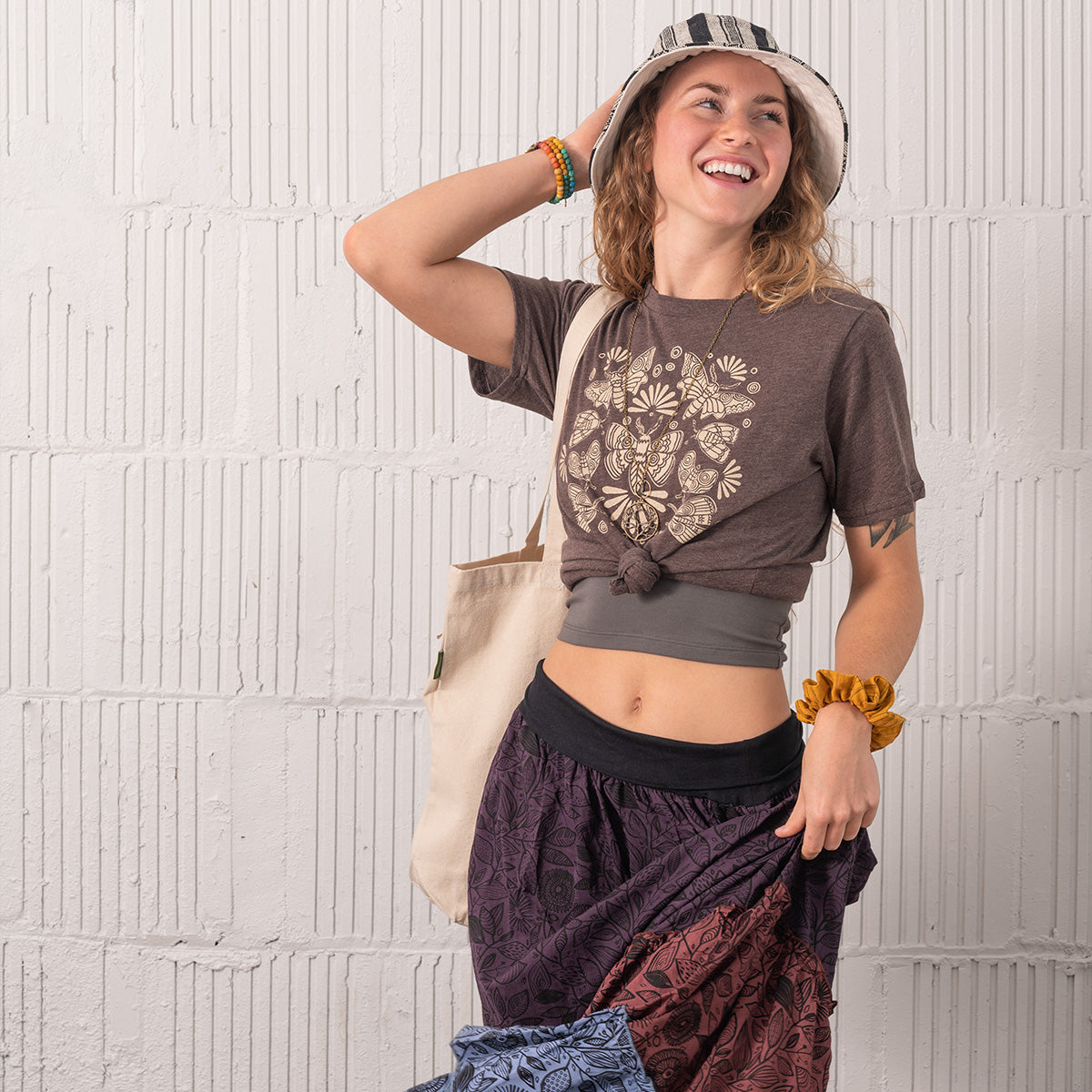 Style guide featuring image of model in tee and maxi skirt and bucket hat. On Soul Flower Blog.
