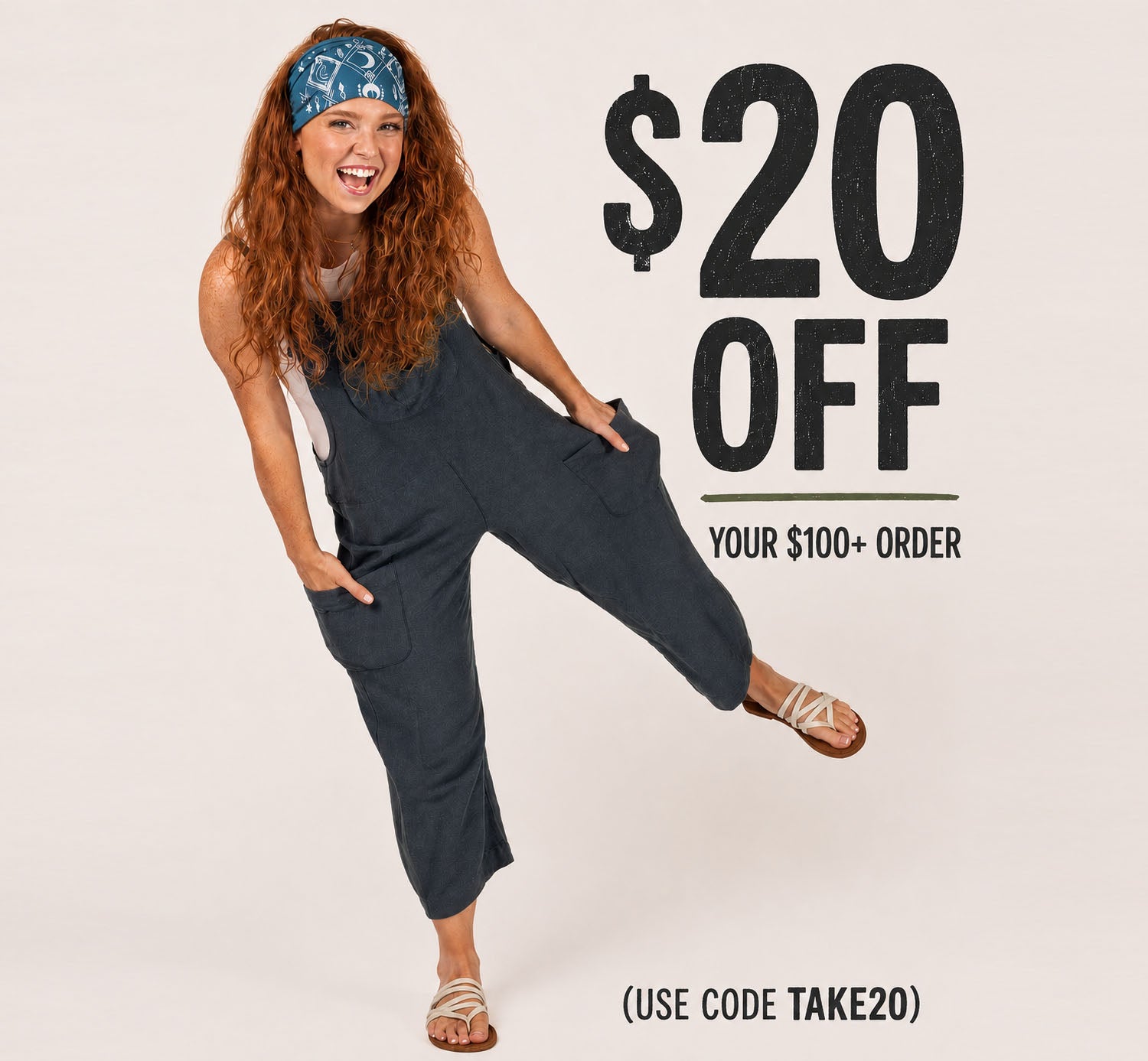 Model with curly red hair wearing soul flower slouchy overalls in midnight 20 dollars off one hundred or more use code take 20