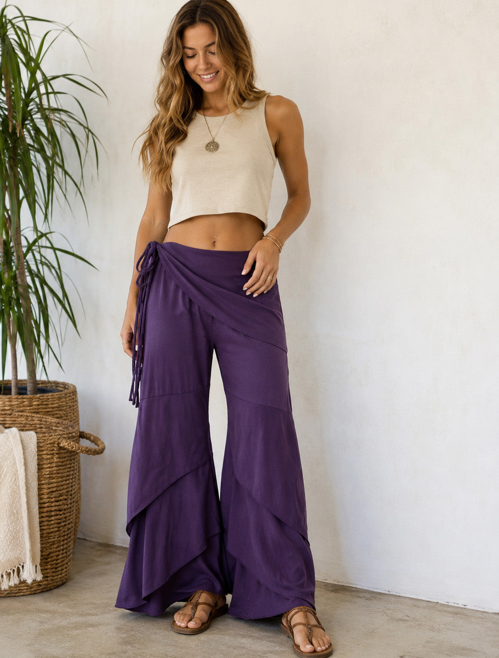 Woman wearing purple Waves of Freedom pants with cascading layered panels