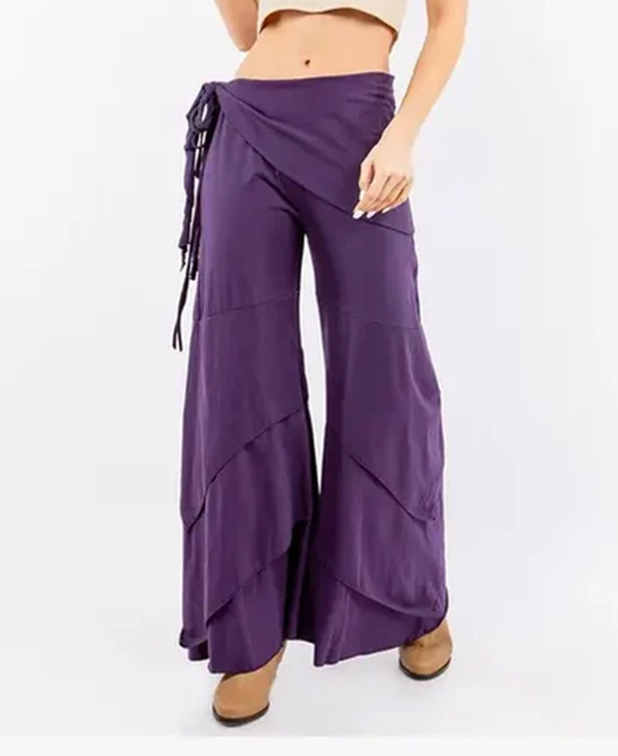 Woman wearing purple Waves of Freedom layered wide leg pants, front view