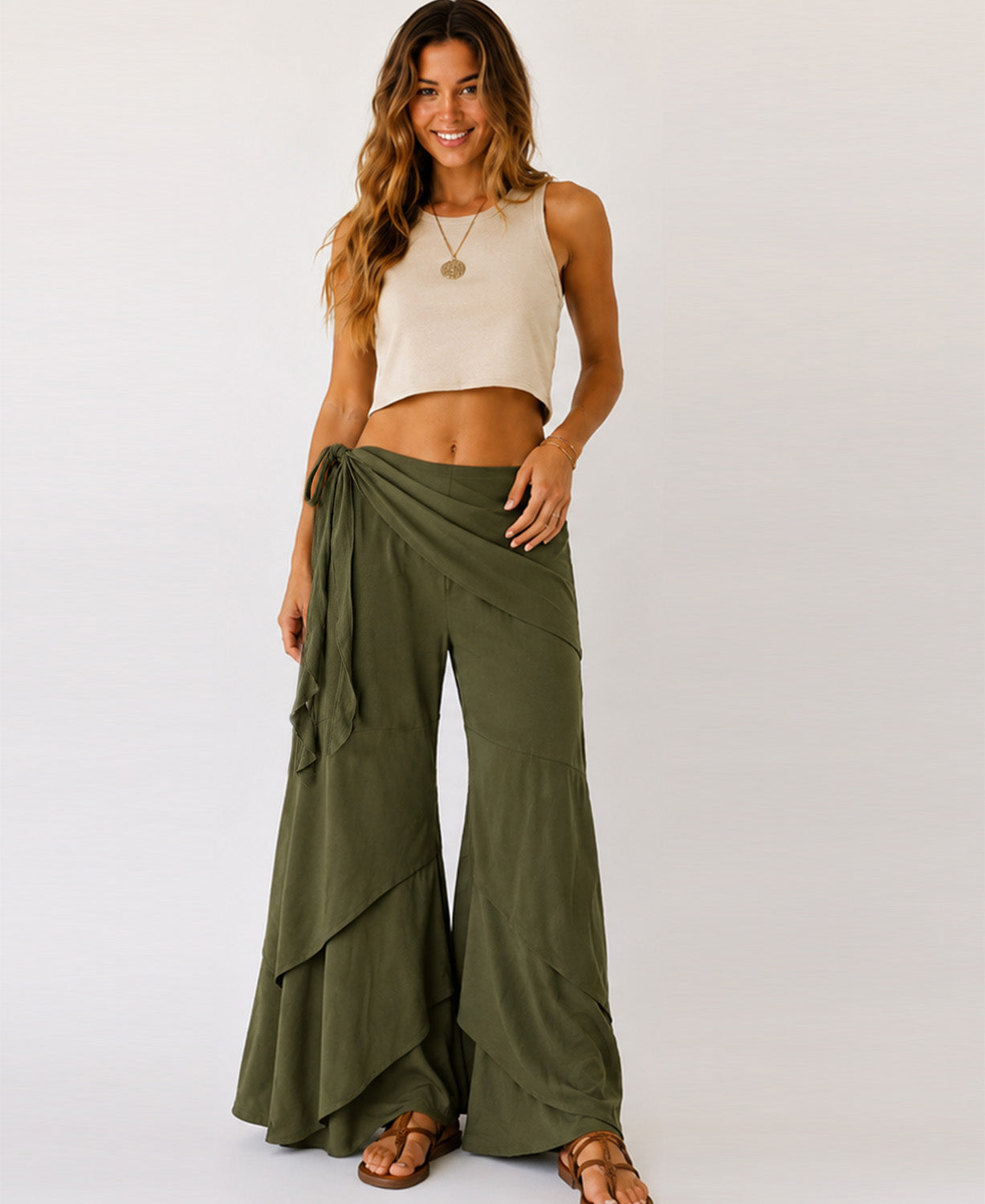 Woman wearing olive green Waves of Freedom layered wide leg pants, front view