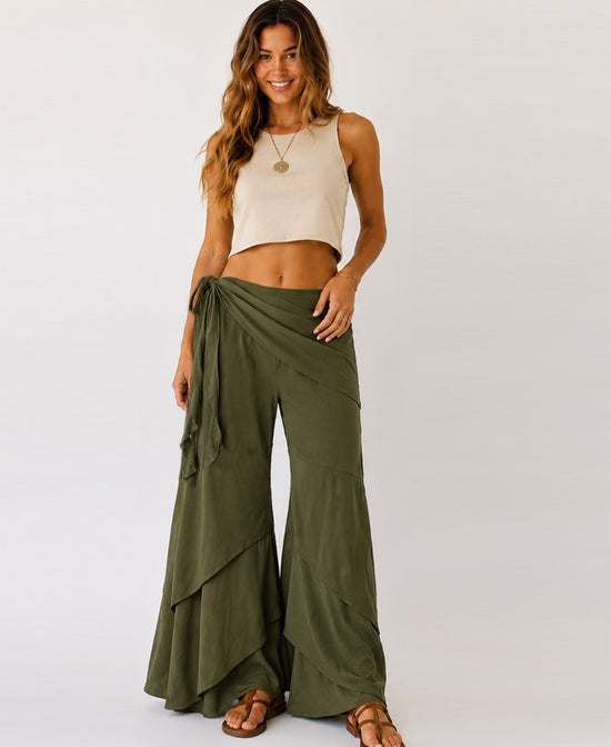Woman wearing olive green Waves of Freedom layered wide leg pants, front view