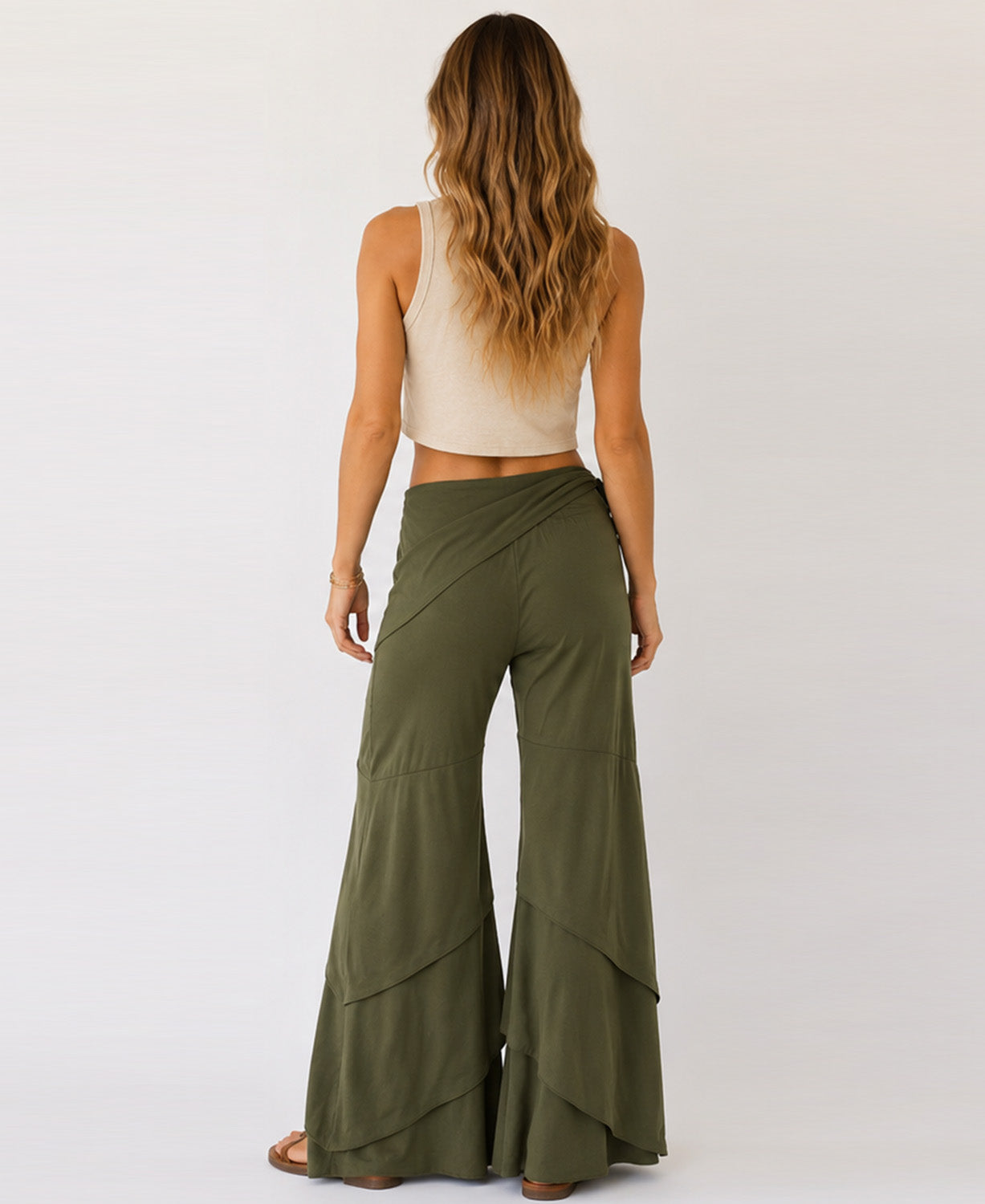 Olive green Waves of Freedom pants showing the flowy layered wide leg design