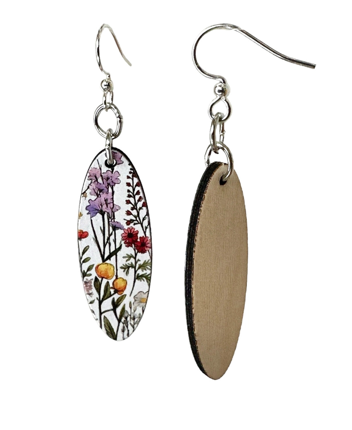 Two oval drop earrings shown on a white background, one front view with a floral print and one back view showing a natural wood grain surface.