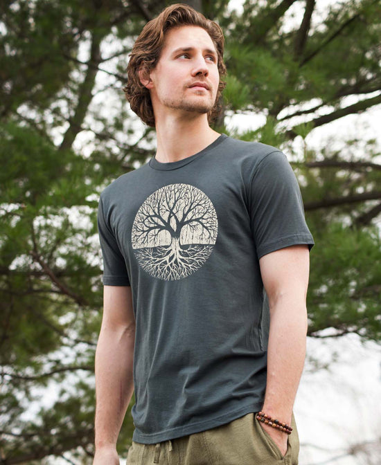 Dark Charcoal Tree of Life T-Shirt on a man outside in front of a pine tree