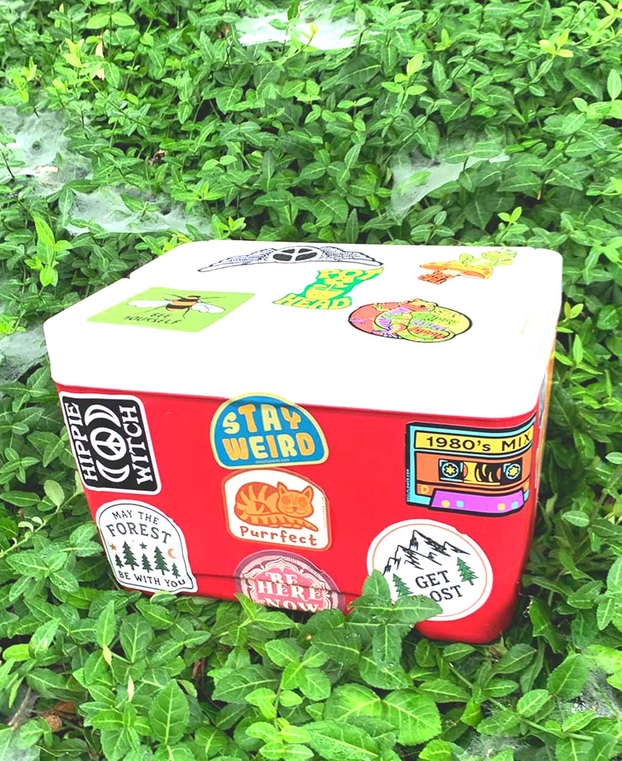 Red Cooler with Soul Flower Hippie Stickers all over it