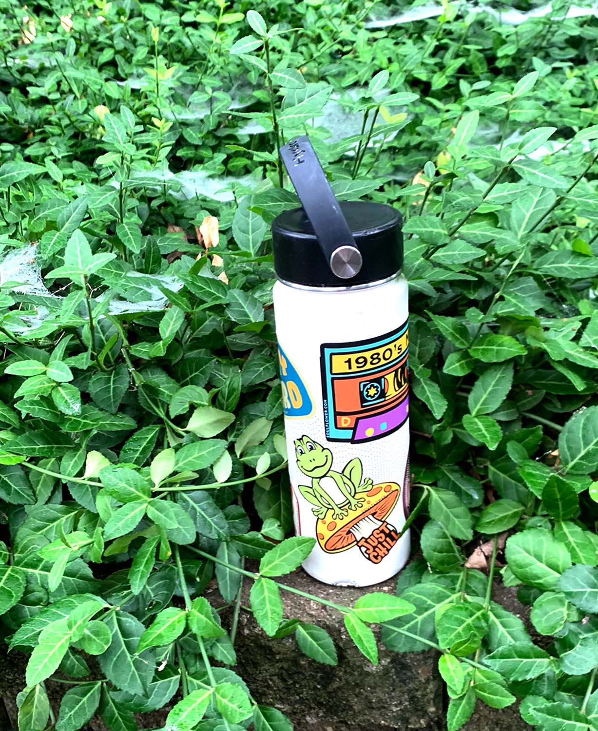 White water bottle with fun soul flower hippie stickers