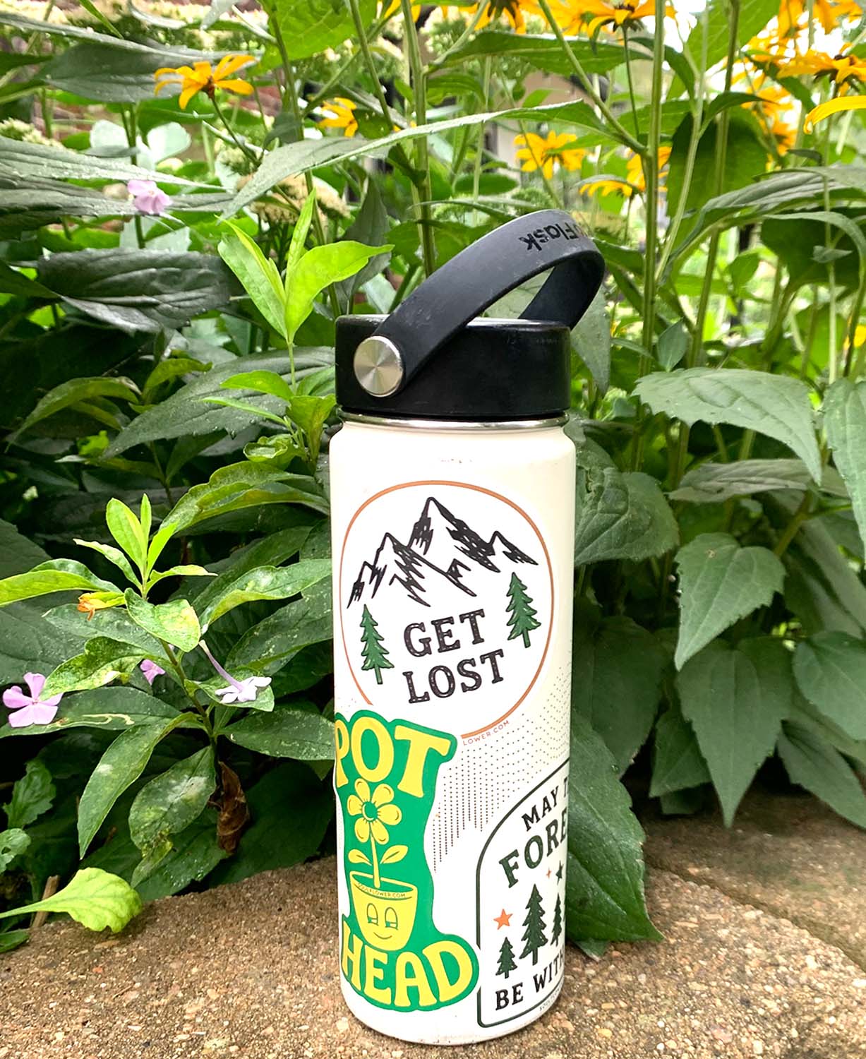 Water Bottle with Soul Flower Hippie Stickers on it