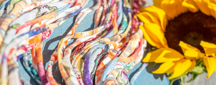 <p>It's not quite Recycling since Upcycling doesn't shred or melt the scraps into brand new raw materials. It skips that extra processing step, making Upcycling even more eco-friendly than Recycling! Think headbands made from deadstock fabric or a purse made from old rice bags. When you turn an empty coffee can into a decorated planter, that's upcycling, too!</p>